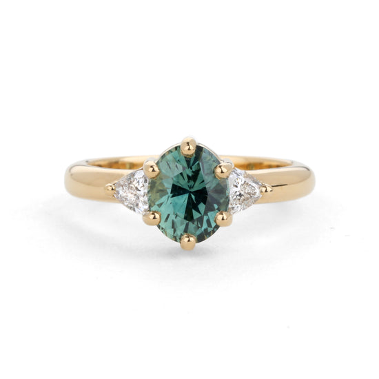 Shimell & Madden Teal Oval Sapphire & Trillion Diamond Trilogy Ring | The Cut London